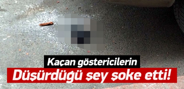 Kaçan göstericiler silah düşürdü